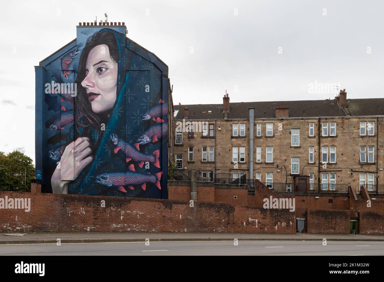 Thenue (St Enoch) mural by Mark Worst and tenement buildings, Abercromby Street in the east end of Glasgow, Scotland, UK Stock Photo