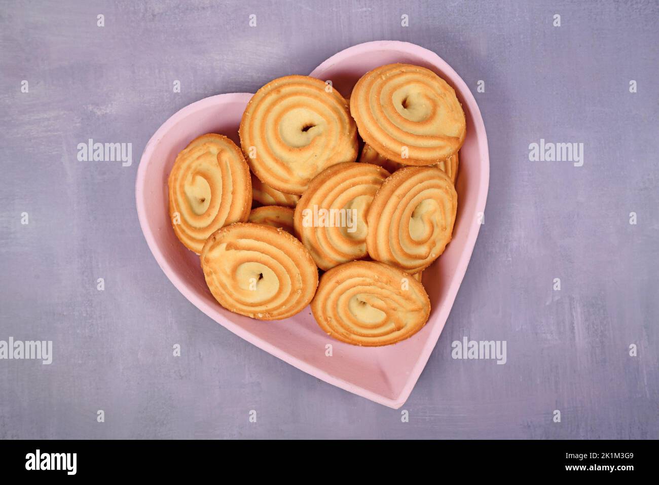 Round ring shaped spritz biscuits called 'Spritzgeback', a type of German butter cookies Stock Photo
