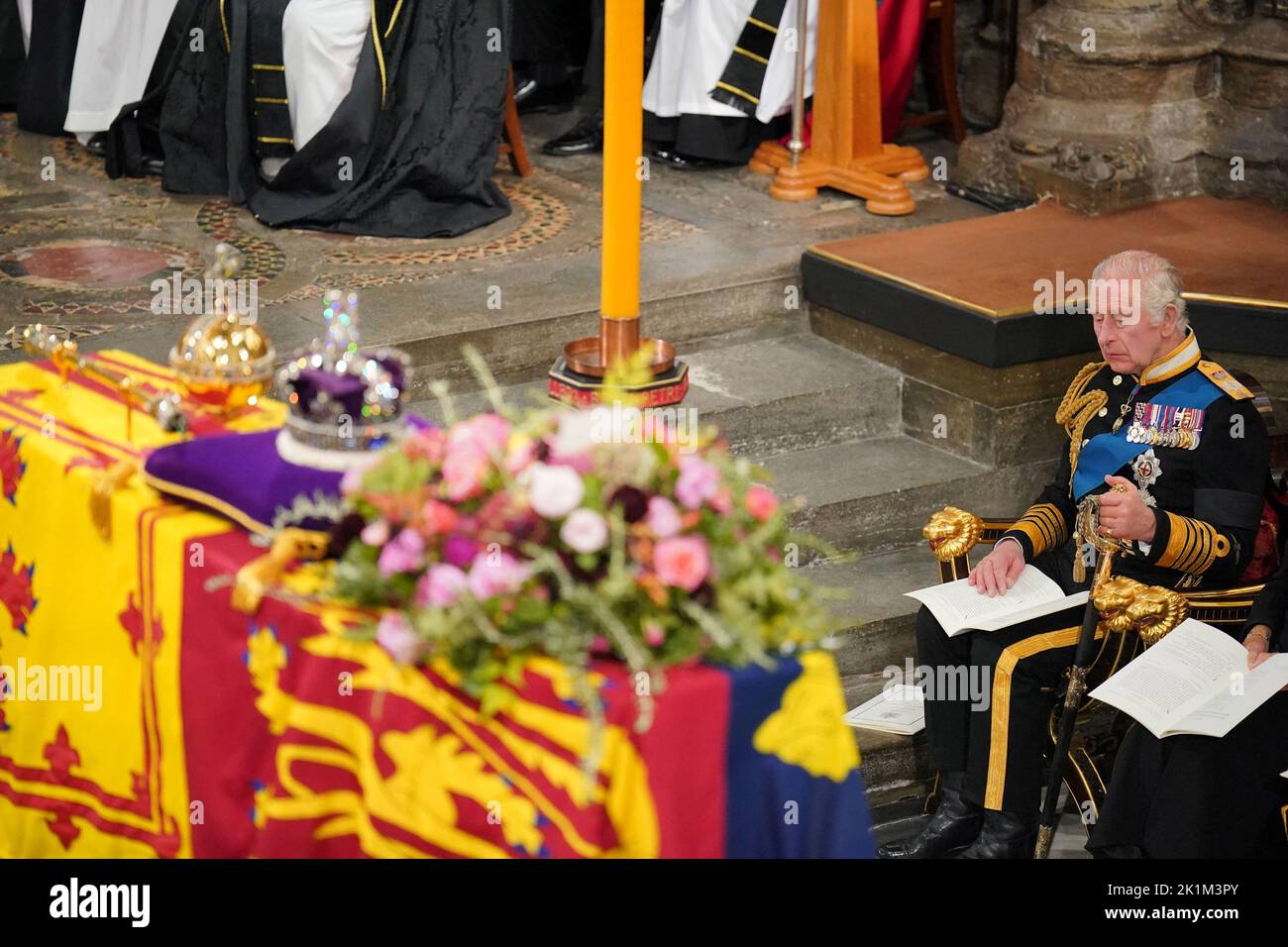 King Charles III in front of the coffin of Queen Elizabeth II during her State Funeral at the Abbey in London. Picture date: Monday September 19, 2022.  Dominic Lipinski/Pool via REUTERS Stock Photo