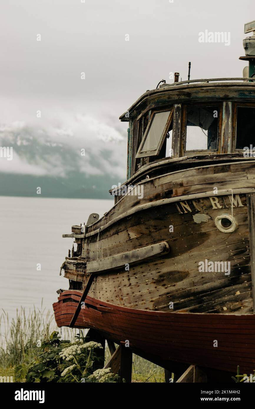 Old Rusted Ship A vertical of an old rusty ship at the beach Stock Photo - Alamy