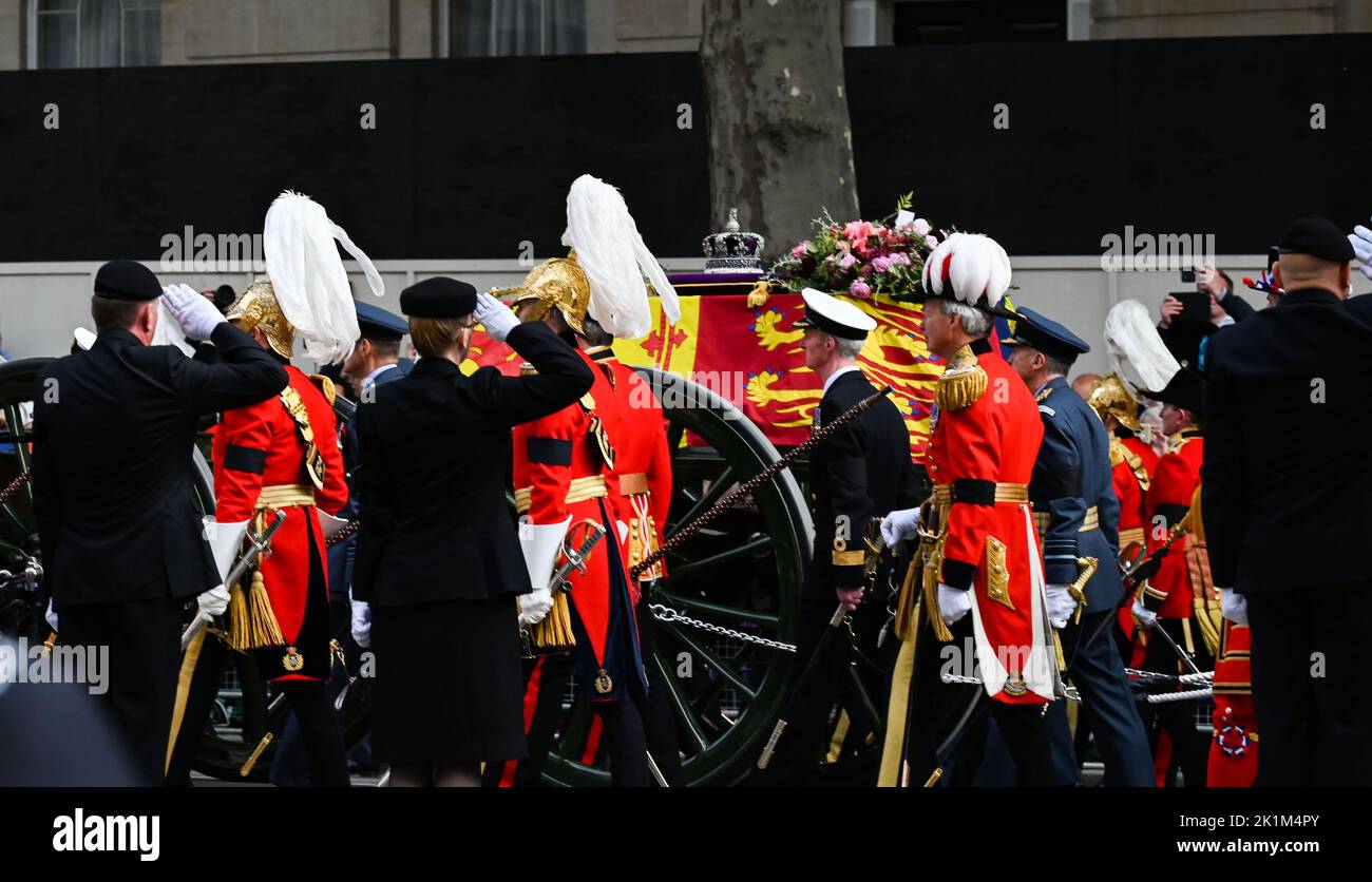 London, UK. 19th Sep, 2022. London UK 19th September 2022 - A salute for the Queen as her coffin passes down Whitehall during the funeral procession of Queen Elizabeth II in London today: Credit Simon Dack / Alamy Live News Credit: Simon Dack News/Alamy Live News Stock Photo