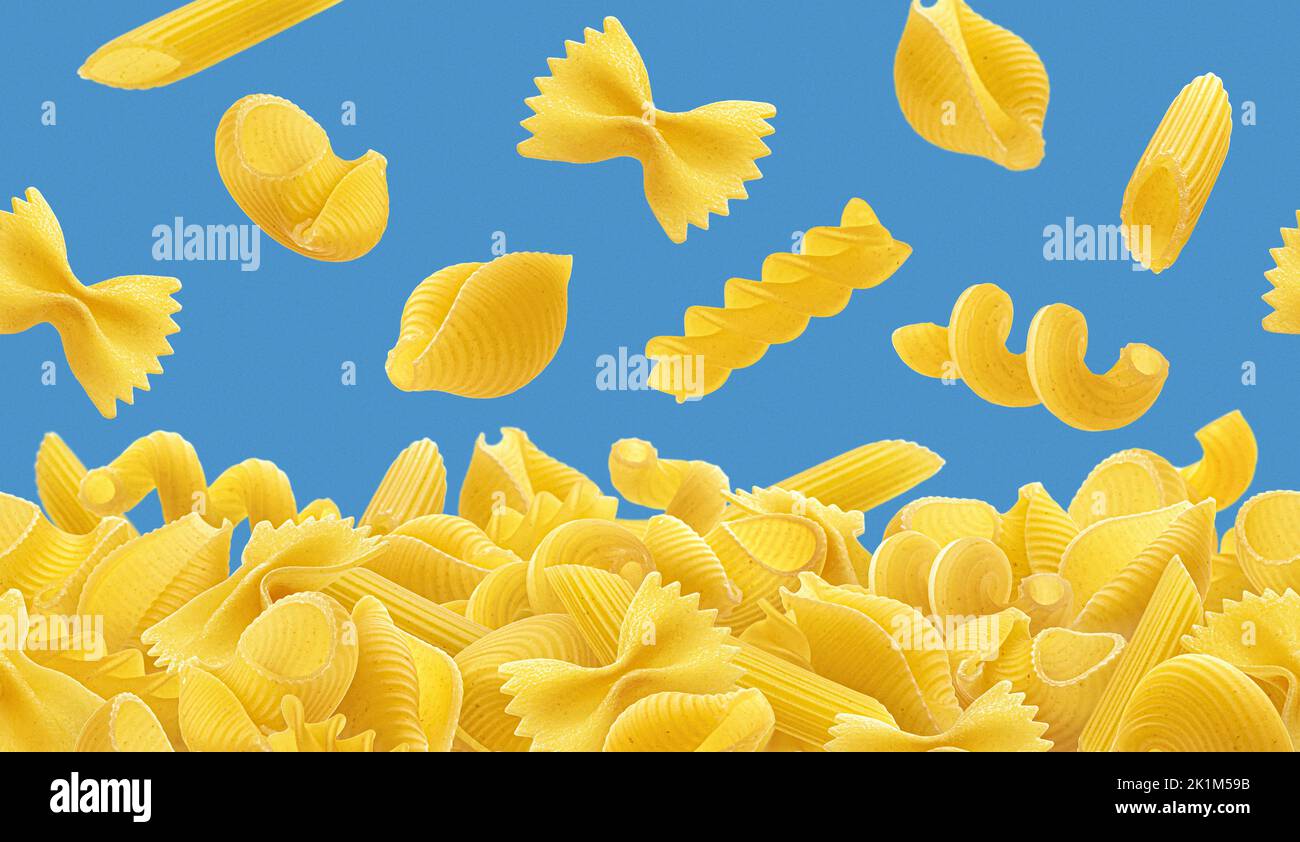 Italian pasta border, falling raw pasta over color background Stock Photo