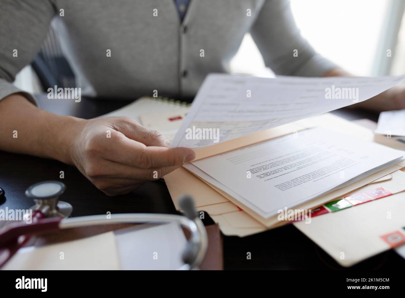 Doctor reading chart hi-res stock photography and images - Alamy