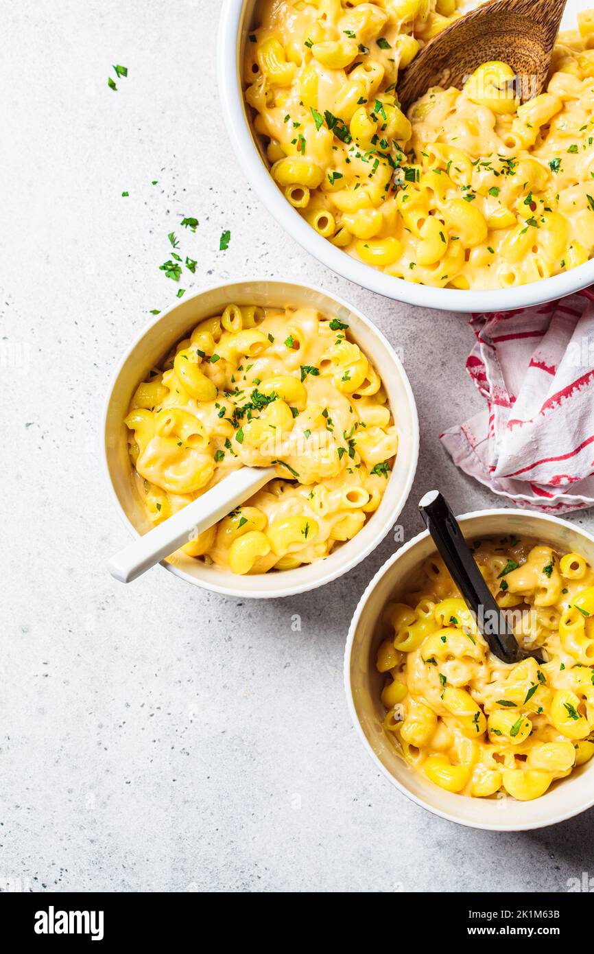 Mac and cheese in white bowl, top view. Traditional American food. Stock Photo