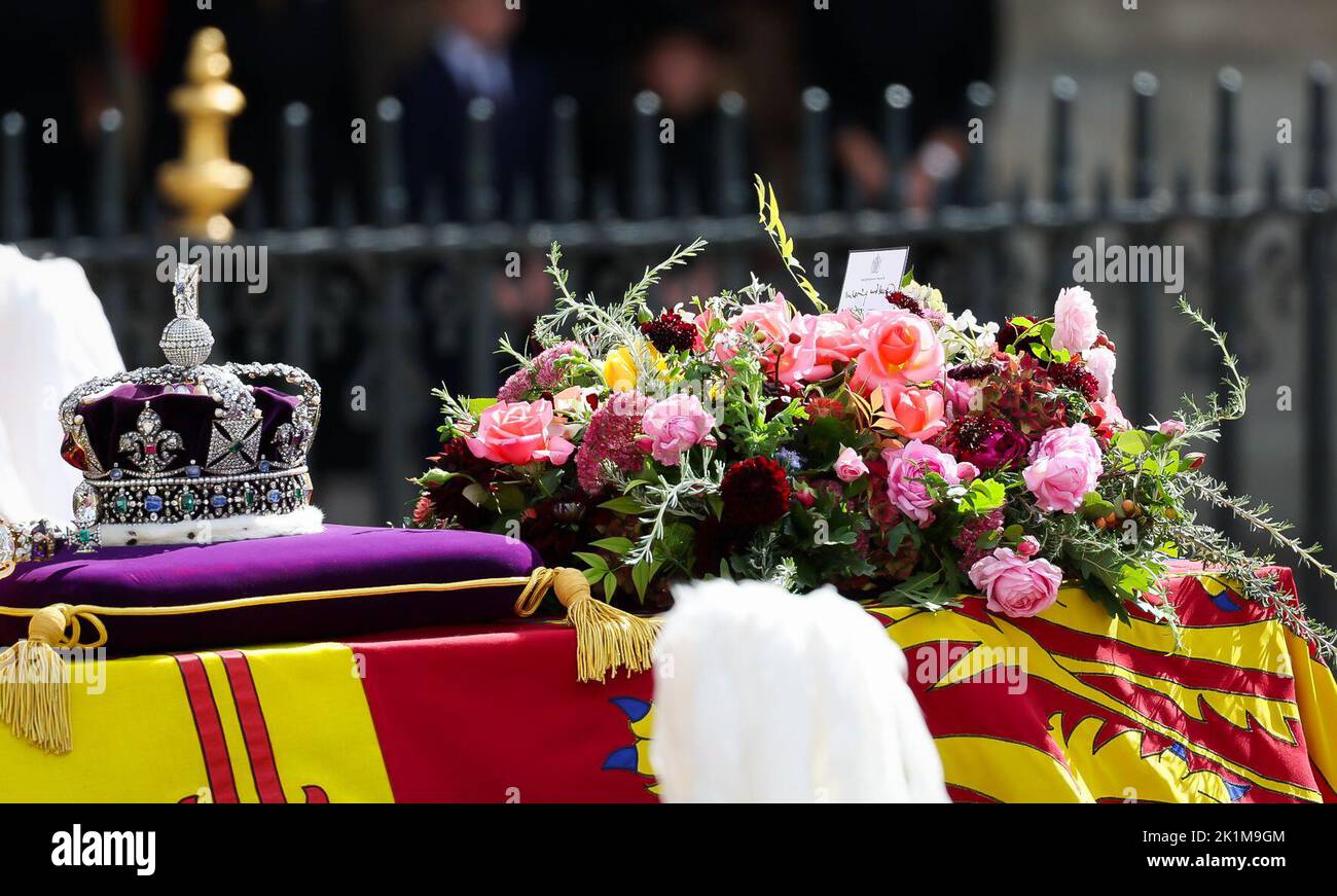 London, UK. 19th Sep, 2022. Pallbearers carry the coffin of Queen Elizabeth II, draped in the royal standard, with the crown, orb and scepter after the state ceremony before the funeral of Queen Elizabeth II in Westminster Abbey. Tucked into the floral wreath was a personal letter from King Charles III to his deceased mother. On it was written, 'In loving and faithful memory. Charles R.' . Hundreds of thousands of people are expected on the streets of London to pay their last respects to the Queen at the state funeral for Elizabeth II. Credit: Christian Charisius/dpa/Alamy Live News Stock Photo
