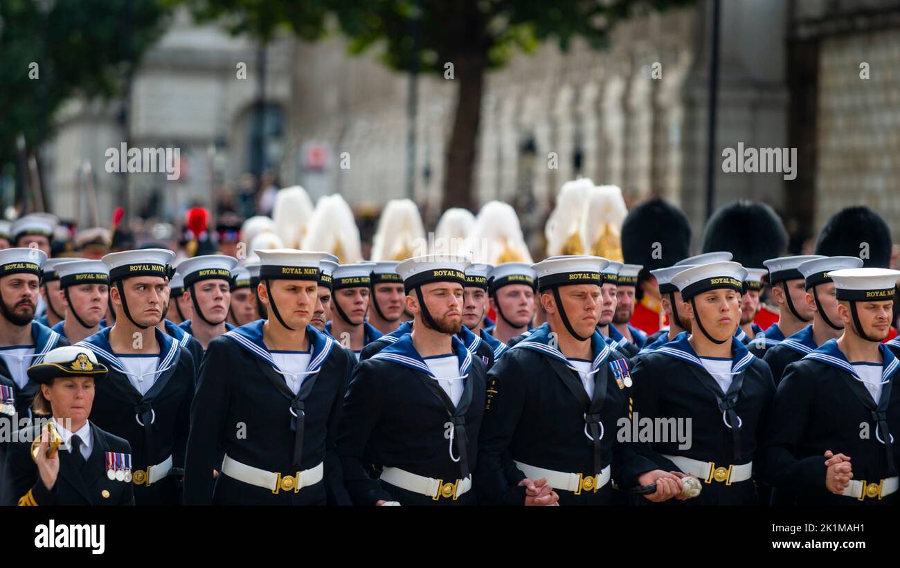 London, UK.  19 September 2022.  Some of the 142 Royal Navy sailors drawing the coffin of the late Queen Elizabeth II carried on The State Gun Carriage in a procession in Whitehall after her state funeral in Westminster Abbey. The Queen will be buried alongside her husband Prince Philip in King George VI Memorial Chapel, Windsor Castle.  Credit: Stephen Chung / Alamy Live News Stock Photo