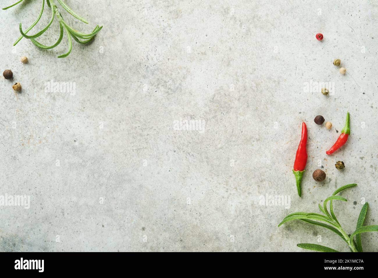 Food cooking background. Green rosemary branches, peppercorns and hot