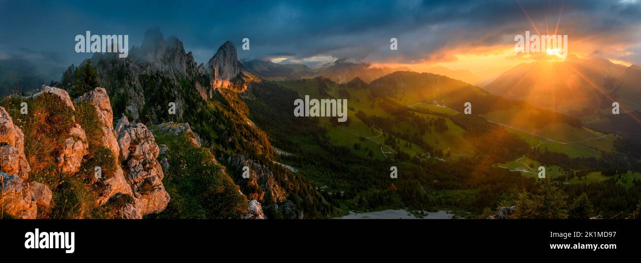 dramatic sunset panorama at the rugged peaks of Gastlosen in the alpine foothills of Fribourg Stock Photo