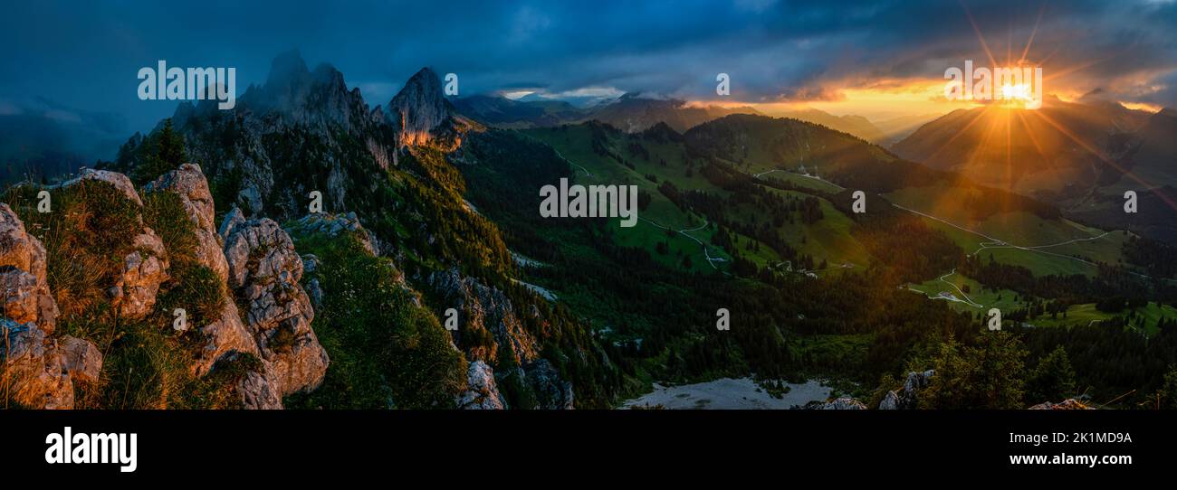 dramatic sunset panorama at the rugged peaks of Gastlosen in the alpine foothills of Fribourg Stock Photo
