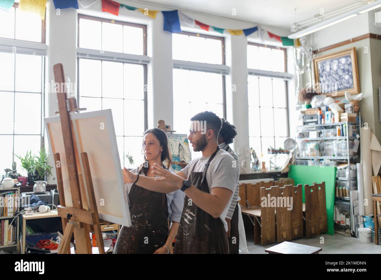 Artists at easel in art studio Stock Photo Alamy