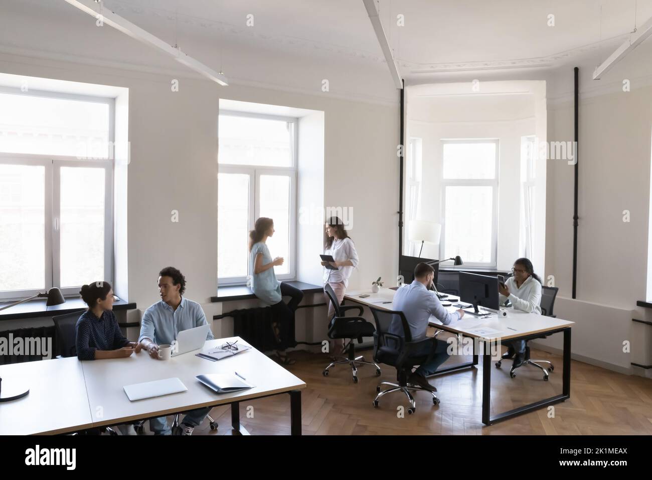 Contemporary loft office space with multiethnic business team Stock Photo