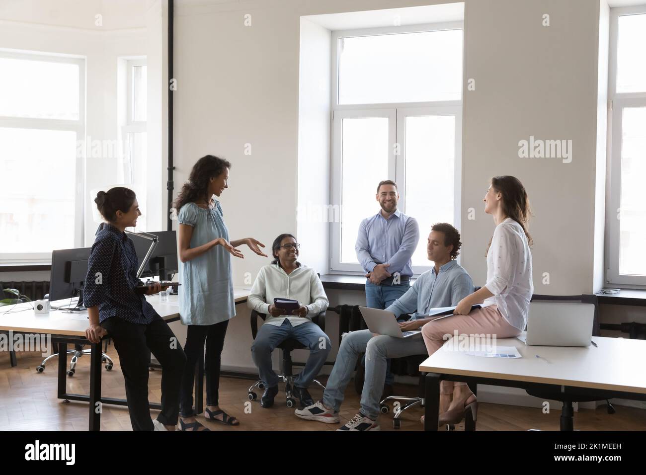 Young multiethnic business team brainstorming in project, sharing creative ideas Stock Photo