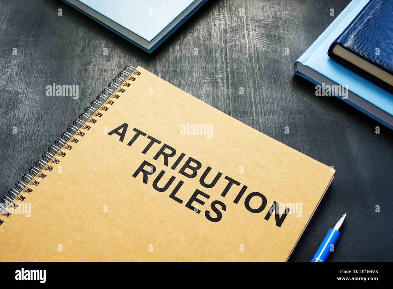 Attribution Rules near a book on the desk. Stock Photo