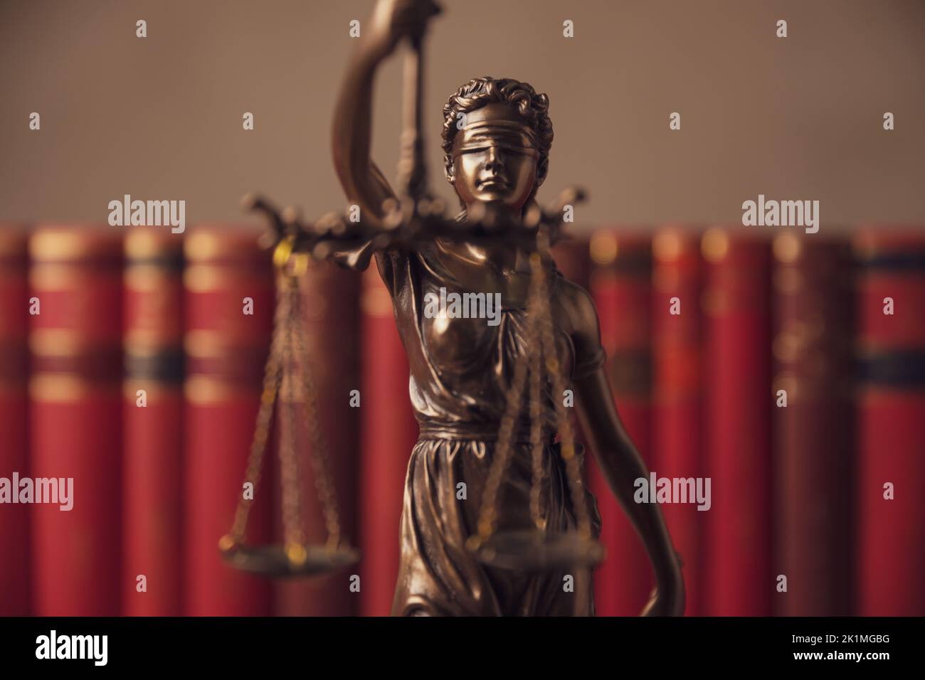 bronze blindfolded goddess representing law statue holding a scale