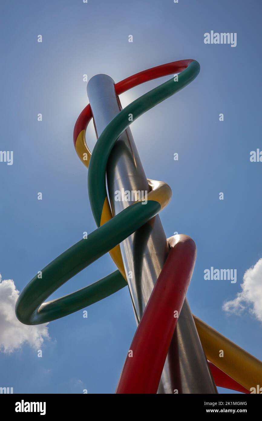 Milan, Italy - June 25, 2022: Vertical View of Colorful Public Artwork in Piazzale Cadorna. Below Angle of Needle, Thread and Knot by Claes Oldenburg. Stock Photo