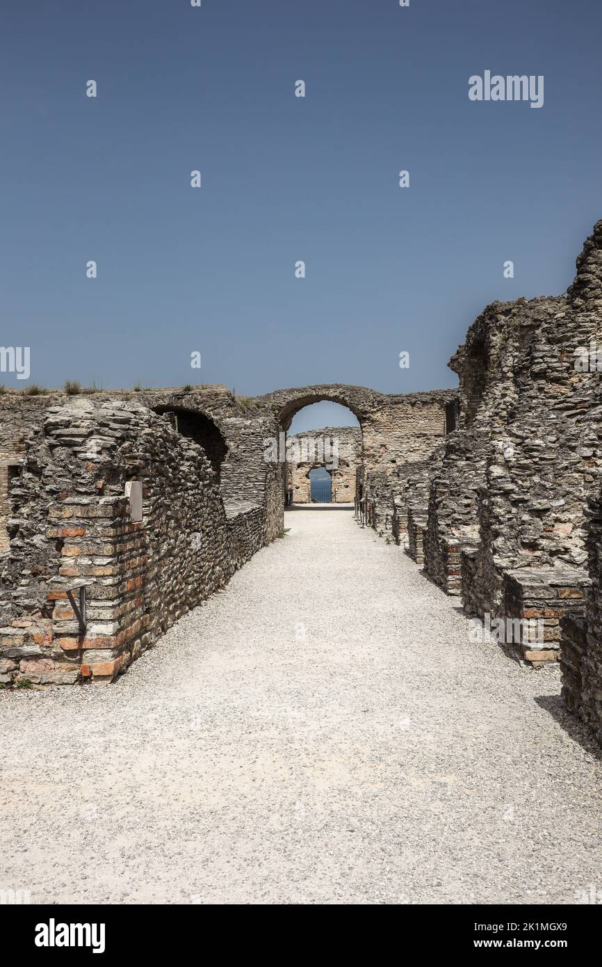 Vertical View of Grottoes of Catullus in Sirmione. Historic Stone Ruins in Italy. Archeological Complex with Blue Sky during Summer Day. Stock Photo