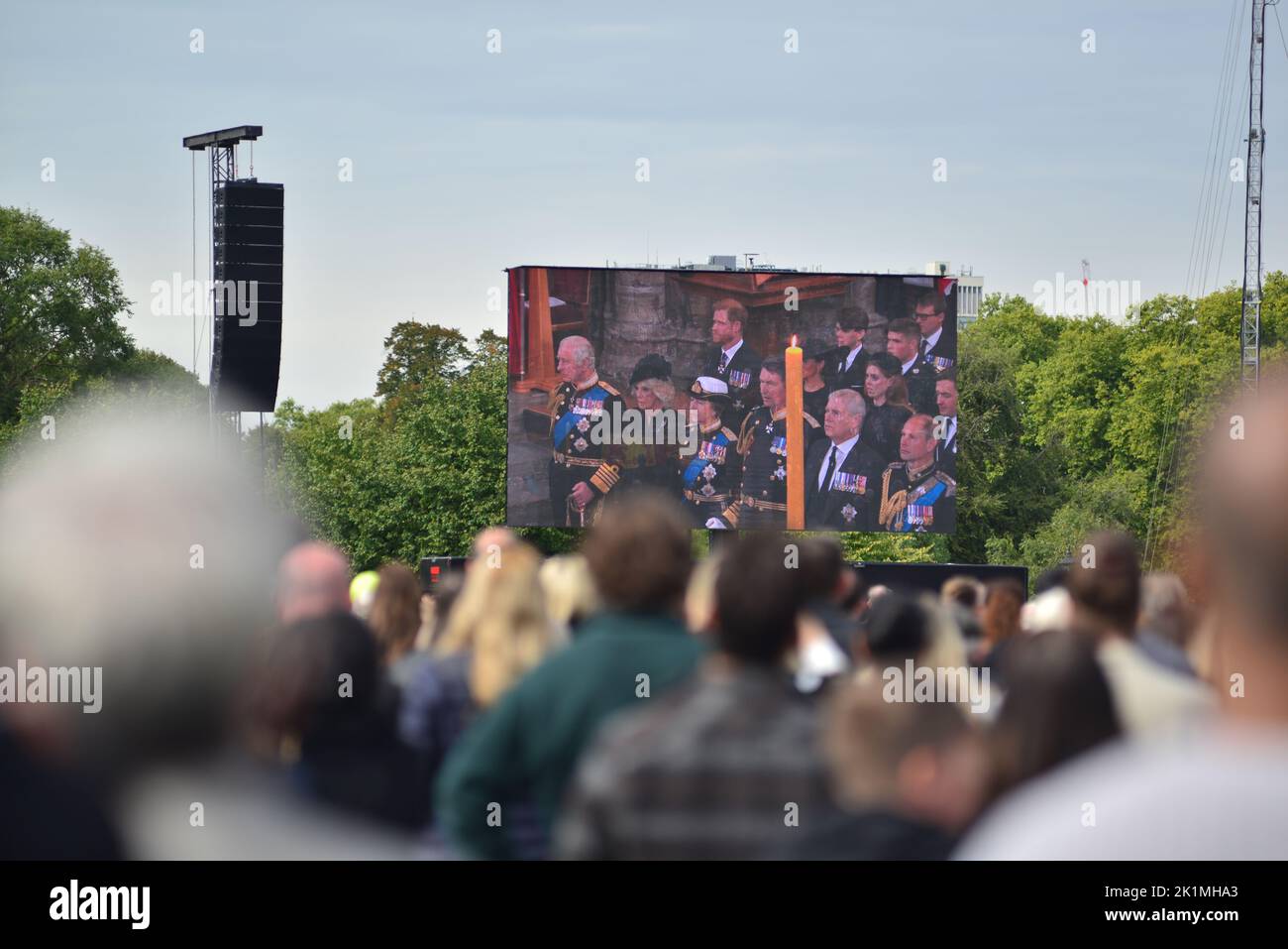 State funeral of Her Majesty Queen Elizabeth II, London, UK, Monday 19th September 2022. Crowds of people watching King Charles III and royal family members at the ceremony from Westminster Abbey on a big screen in Hyde Park. Stock Photo