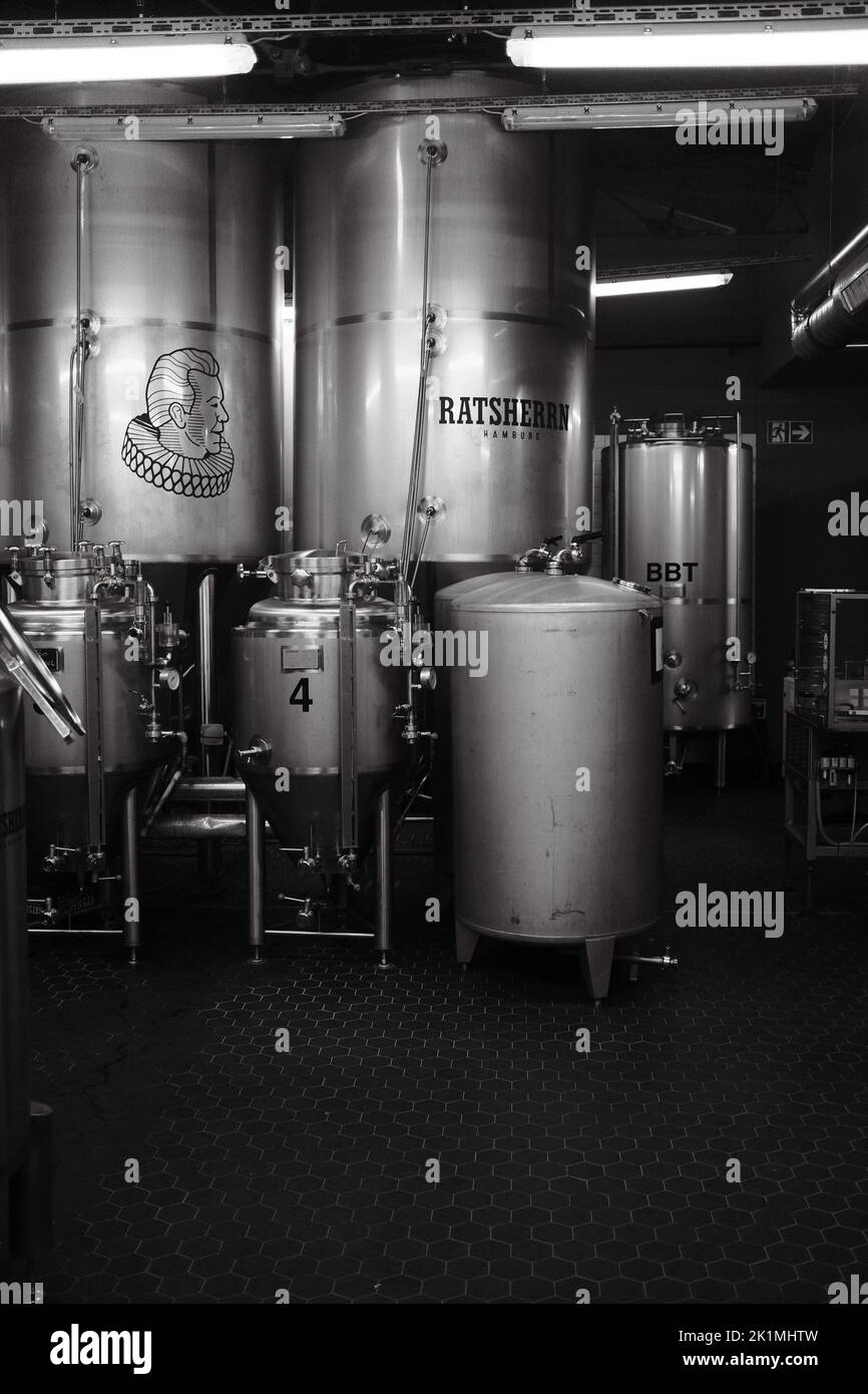 The vertical grayscale of fermenting vats in Ratsherrn Brauerei GmbH
