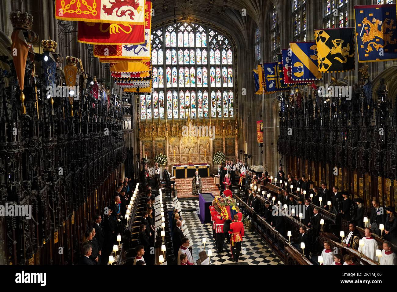 The coffin of Queen Elizabeth II is carried by the Bearer Party in to the Committal Service at St George's Chapel in Windsor Castle, Berkshire. Picture date: Monday September 19, 2022. Stock Photo