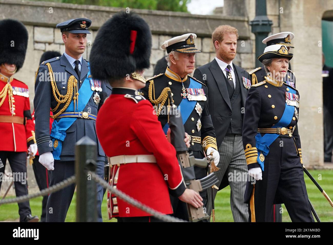 (left to right) The Prince of Wales, the Duke of Sussex, King Charles III, the Princess Royal follow the State Hearse carrying the coffin of Queen Elizabeth II, draped in the Royal Standard with the Imperial State Crown and the Sovereign's Orb and Sceptre, as it arrives at the Committal Service held at St George's Chapel in Windsor Castle, Berkshire. Picture date: Monday September 19, 2022. Stock Photo