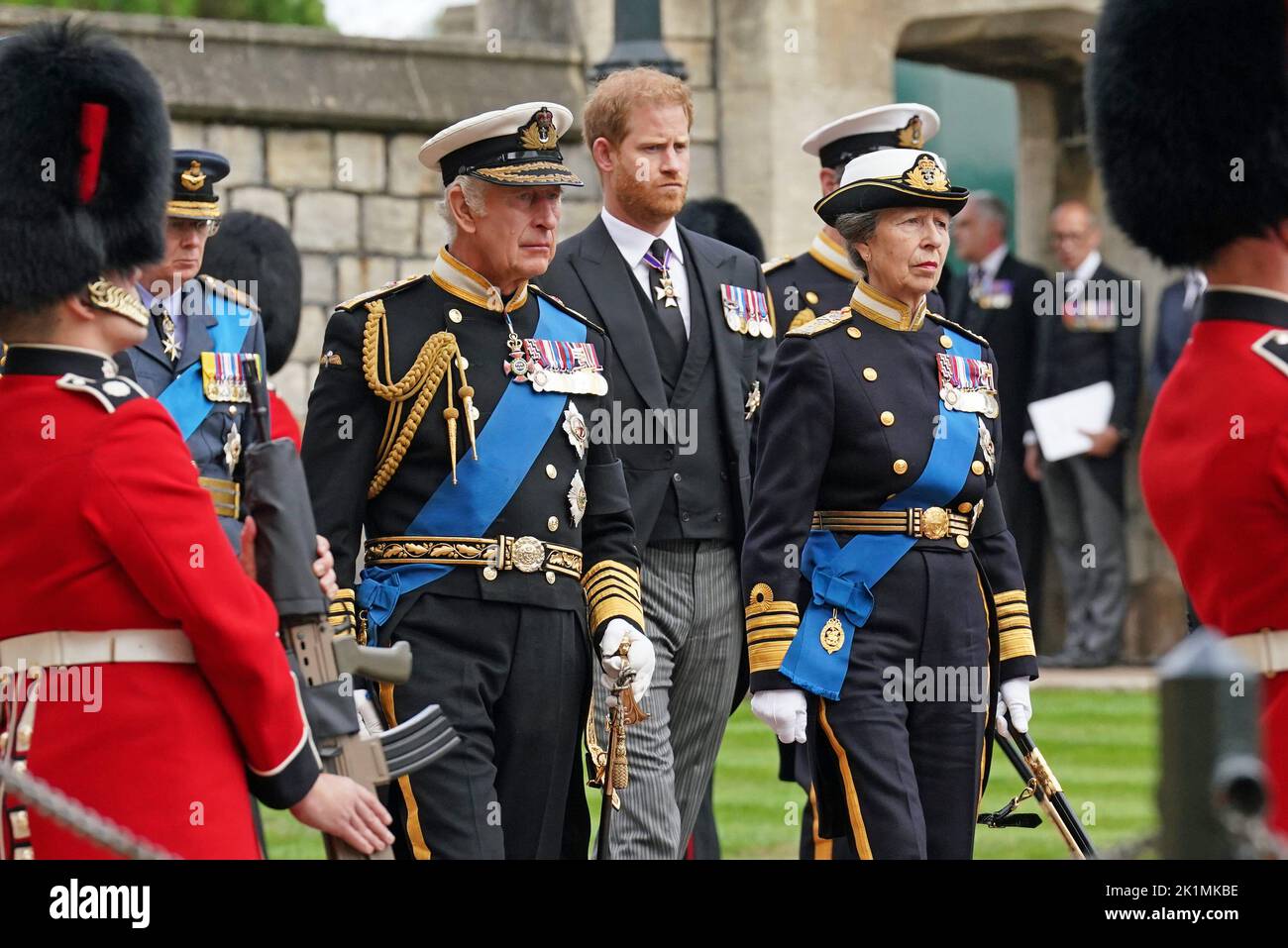 (left to right) The Duke of Sussex, King Charles III and the Princess Royal follow the State Hearse carrying the coffin of Queen Elizabeth II, draped in the Royal Standard with the Imperial State Crown and the Sovereign's Orb and Sceptre, as it arrives at the Committal Service held at St George's Chapel in Windsor Castle, Berkshire. Picture date: Monday September 19, 2022. Stock Photo