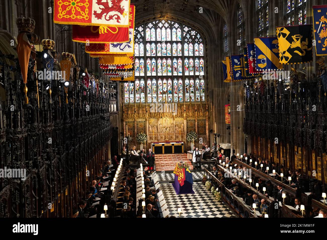 The coffin of Queen Elizabeth II, draped in the Royal Standard with the Imperial State Crown and the Sovereign's orb and sceptre, during the Committal Service at St George's Chapel in Windsor Castle, Berkshire. Picture date: Monday September 19, 2022. Stock Photo
