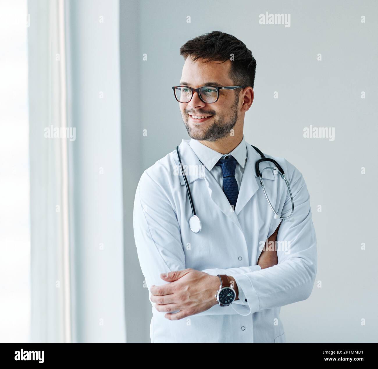 young doctor hospital medical medicine health care clinic office portrait glasses man stethoscope specialist Stock Photo