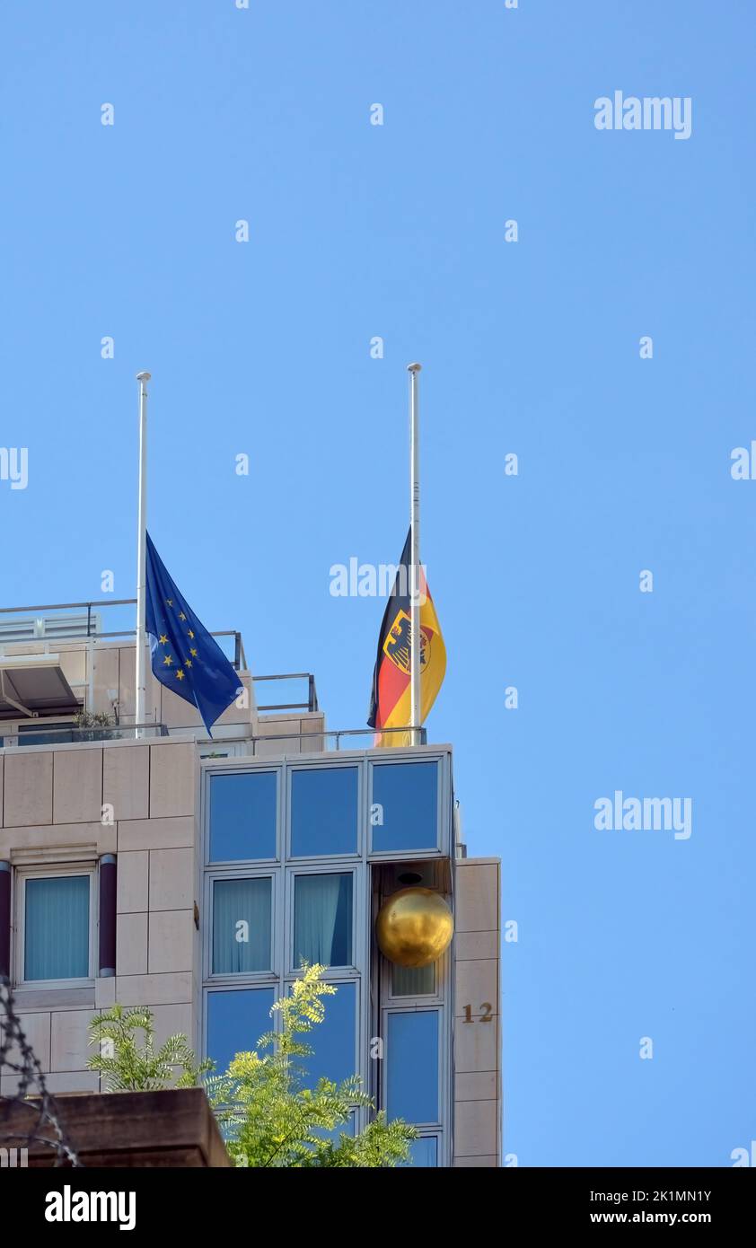 The German and EU flags at half mast on the building of the German