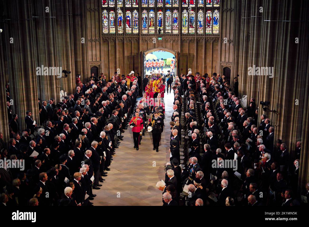 King Charles III and members of the royal family follow behind the coffin of Queen Elizabeth II as it is carried into St George's Chapel in Windsor Castle, Berkshire for her Committal Service. Picture date: Monday September 19, 2022. Stock Photo