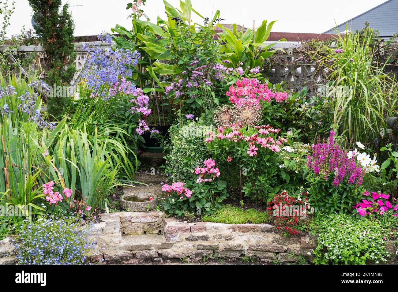 Beautiful potted flowers arrangements in the garden Stock Photo