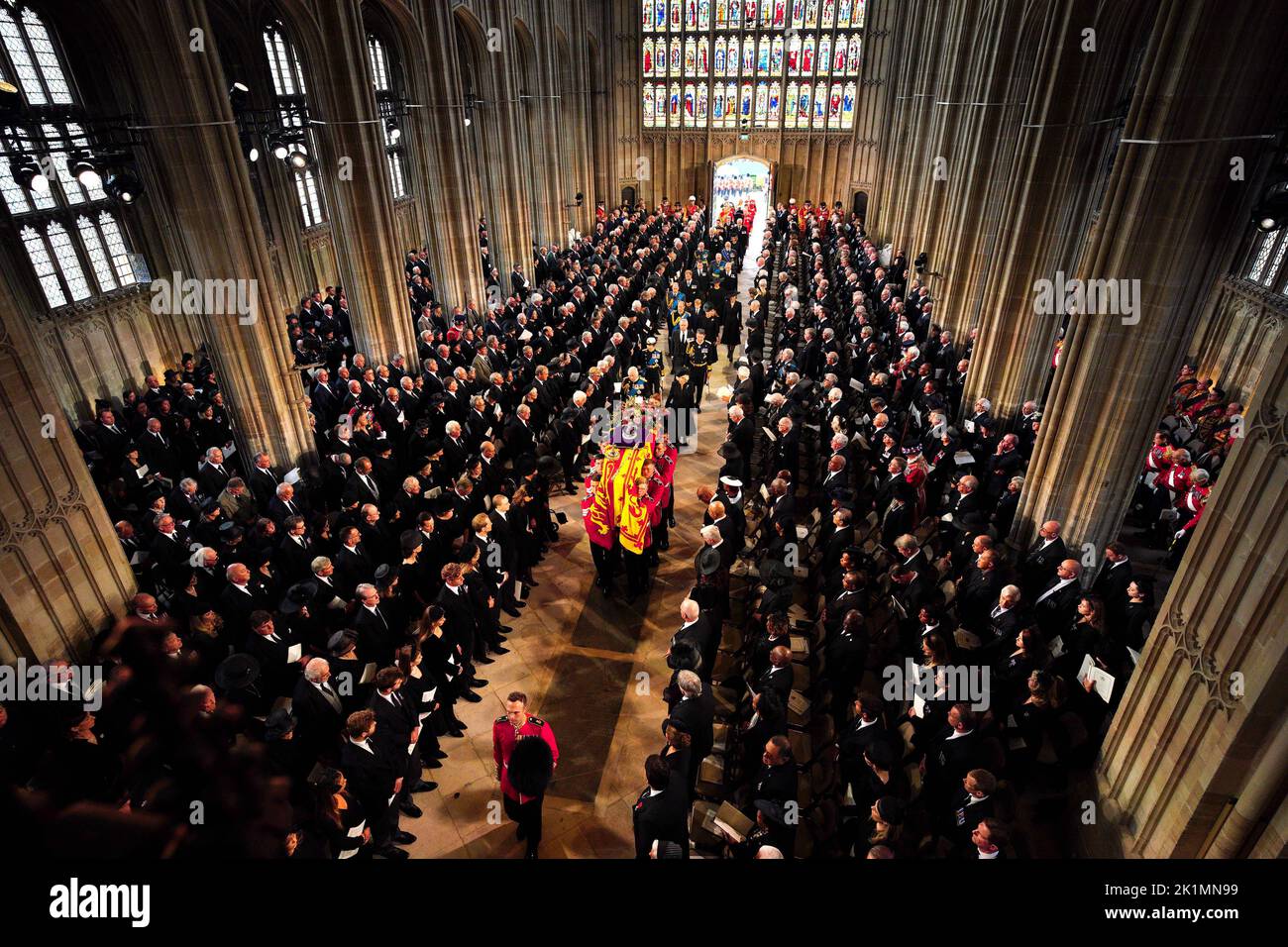 King Charles III and members of the royal family follow behind the coffin of Queen Elizabeth II as it is carried into St George's Chapel in Windsor Castle, Berkshire for her Committal Service. Picture date: Monday September 19, 2022. Stock Photo