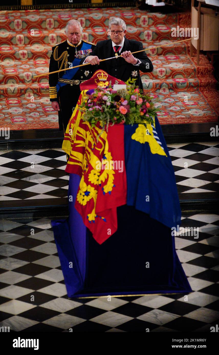 King Charles III watches as the Lord Chamberlain breaks his Wand of Office at the Committal