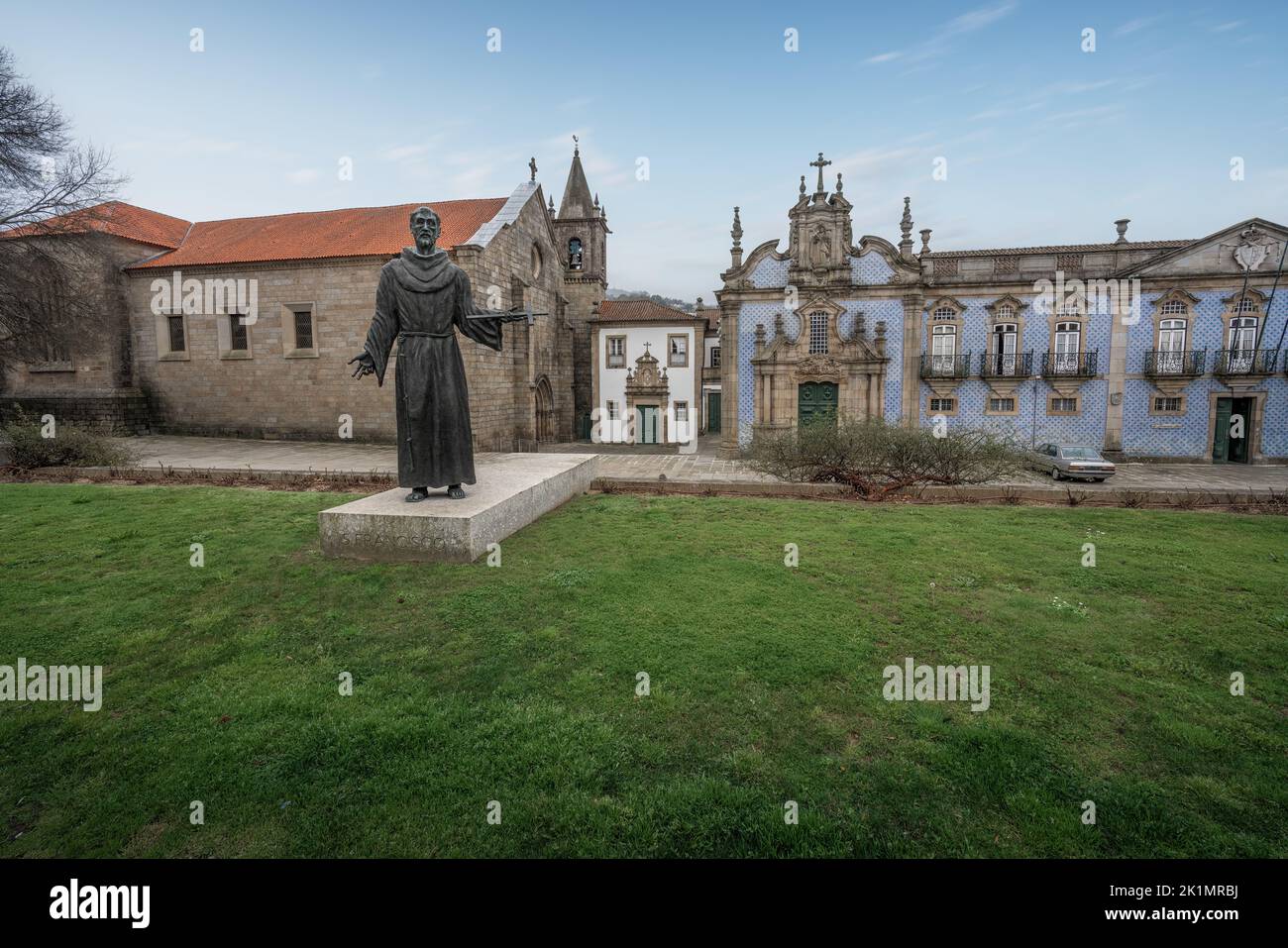 Statue and Church of St. Francis at Largo de Sao Francisco - Guimaraes, Portugal Stock Photo