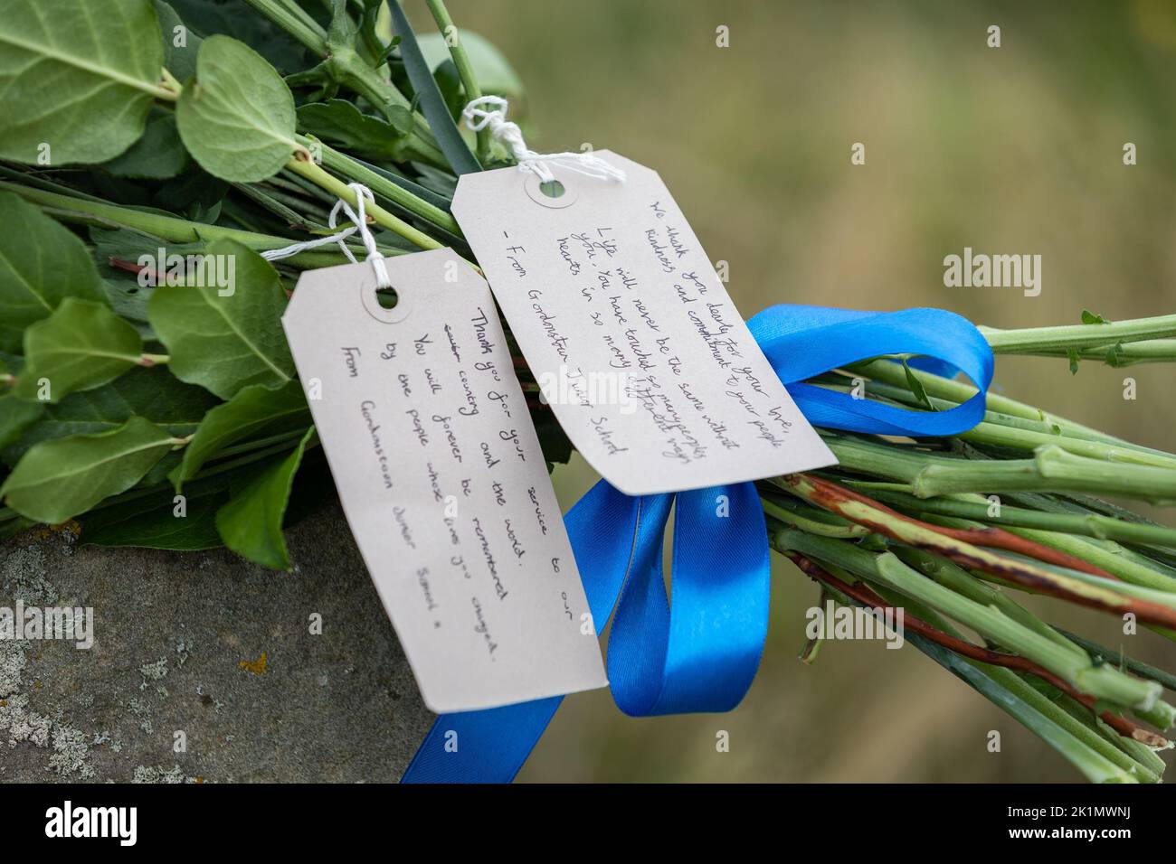 Flowers left after children and teachers from Gordonstoun School marks the state funeral of Queen Elizabeth II by walking to the Coastguard watchtower at nearby Covesea was opened by Prince Philip in 1955 and was used by King Charles III during his time as a Captain of the Coastguard Service at Gordonstoun. Picture date: Monday September 19, 2022. Stock Photo