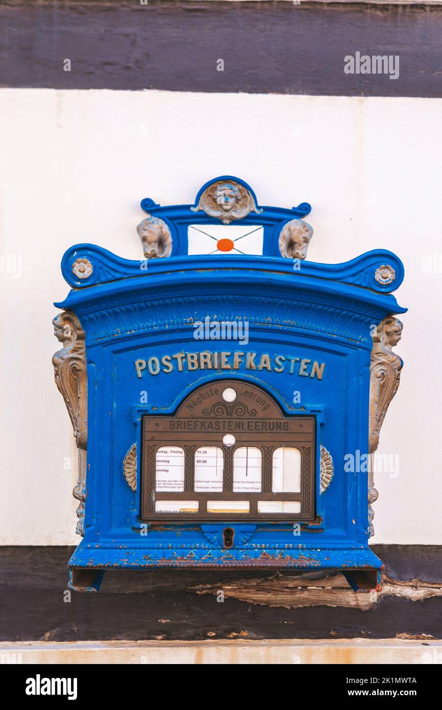 Public blue mailbox on a wall in germany Stock Photo