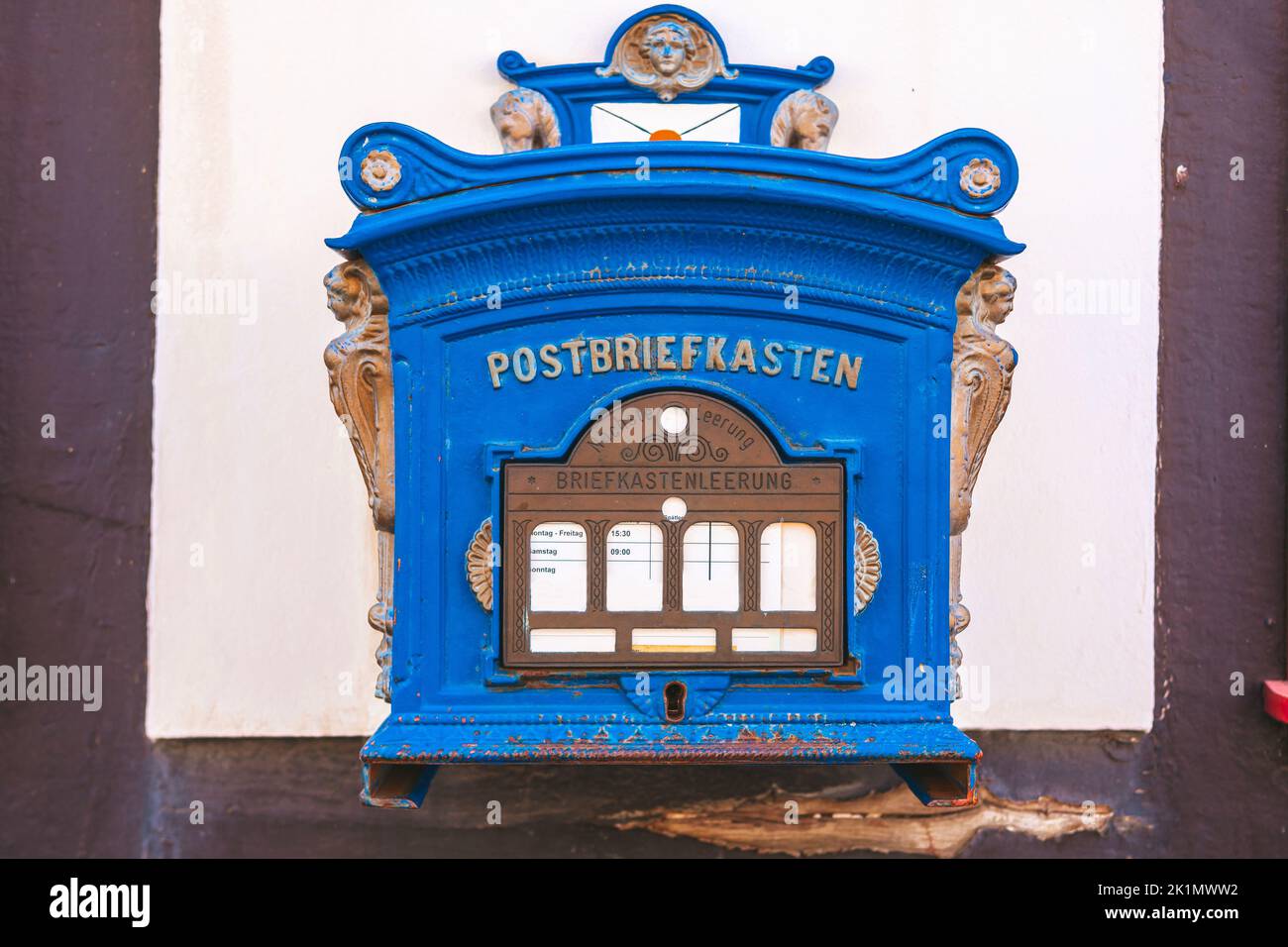 Public blue mailbox on a wall in germany Stock Photo Alamy