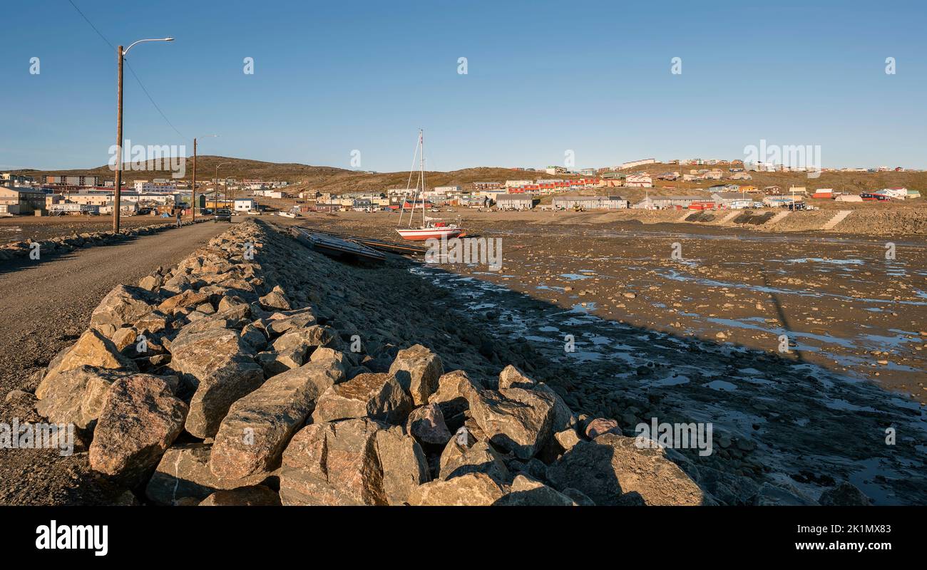 Low tide with a distant view of the skyline of the city of Iqaluit in Nunavut, Canada Stock Photo