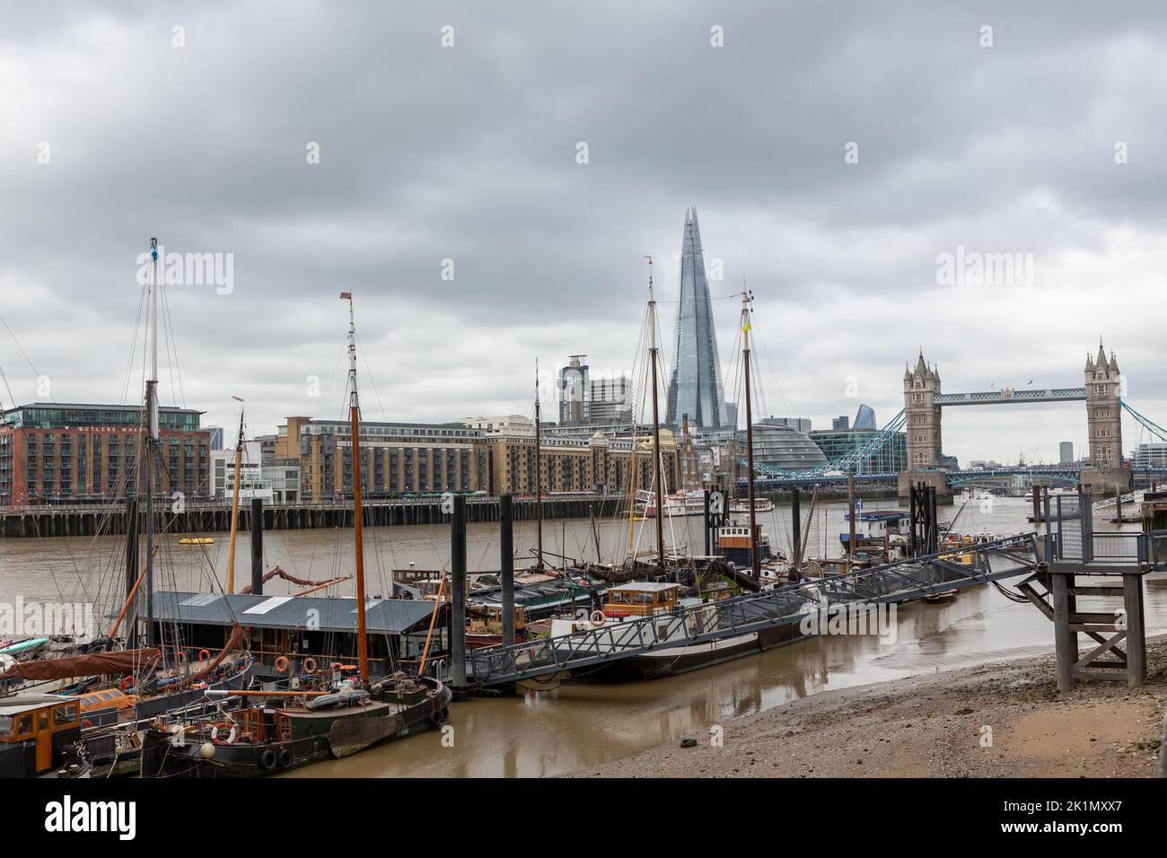 View of the River Thames in London on an Autumn day. Barges near saint katharine dock in the foreground. Stock Photo