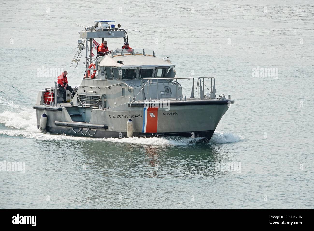 A US Coast Guard 47 foot motor llifeboat cruises down the harbor near Florence, Oregon Stock Photo