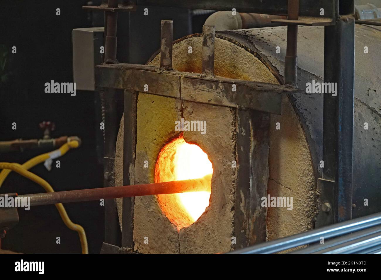 A glass blowing furnace in a glass blowing studio in the small town of Seal Rock, Oregon. Stock Photo