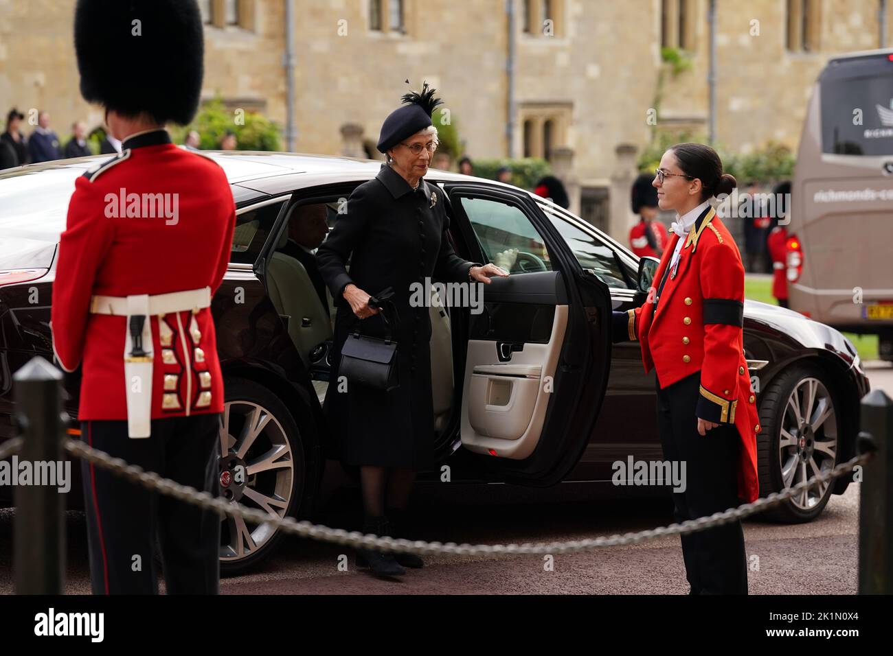 A mourner arrives at the Committal Service for Queen Elizabeth II, held at St George's Chapel in Windsor Castle, Berkshire. Picture date: Monday September 19, 2022. Stock Photo