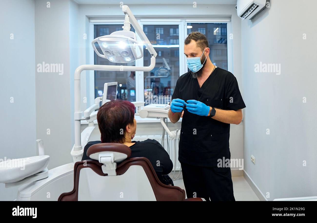 dentist in the office receives the patient Stock Photo Alamy