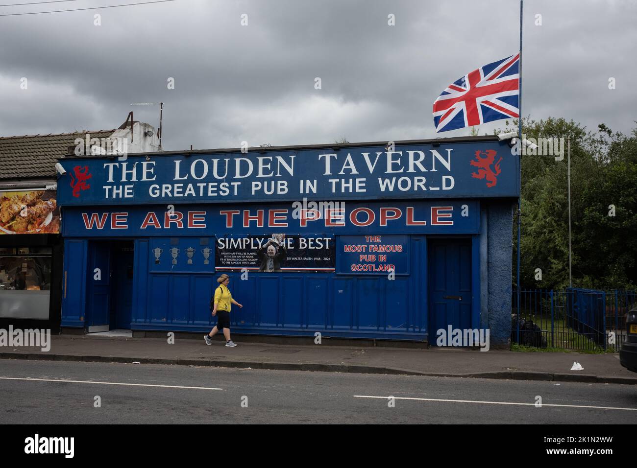 Glasgow, Scotland, 19 September 2022. The Union flag flies at half mast on the Rangers FC supporters’ Louden Tavern bar, as a mark of respect for Her Majesty Queen Elizabeth II who died on 8th September, in Glasgow, Scotland, 19 September 2022. Photo credit: Jeremy Sutton-Hibbert/Alamy Live News. Stock Photo