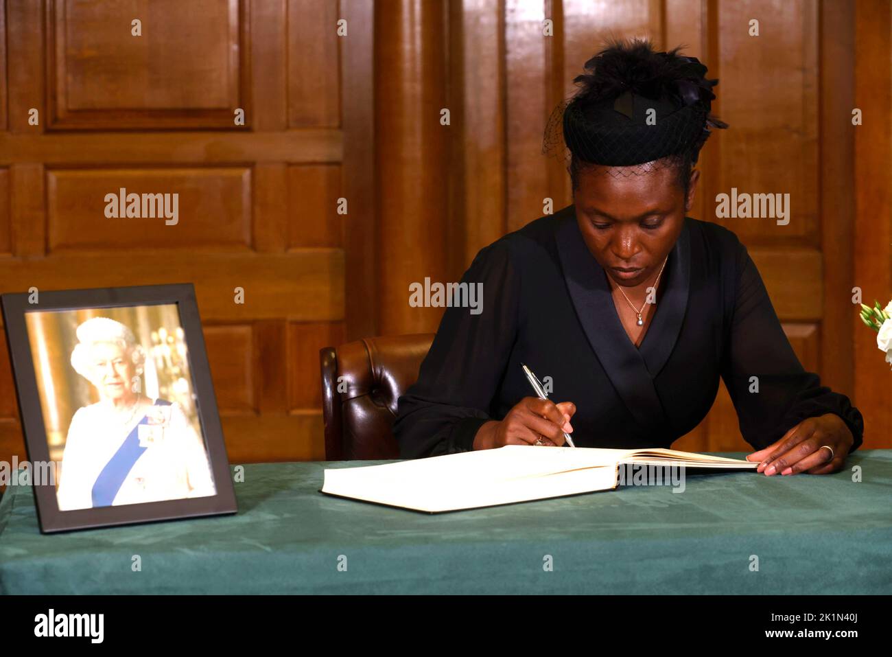 Governor of Bermuda, Rena Lalgie, signs a book of condolence at Church