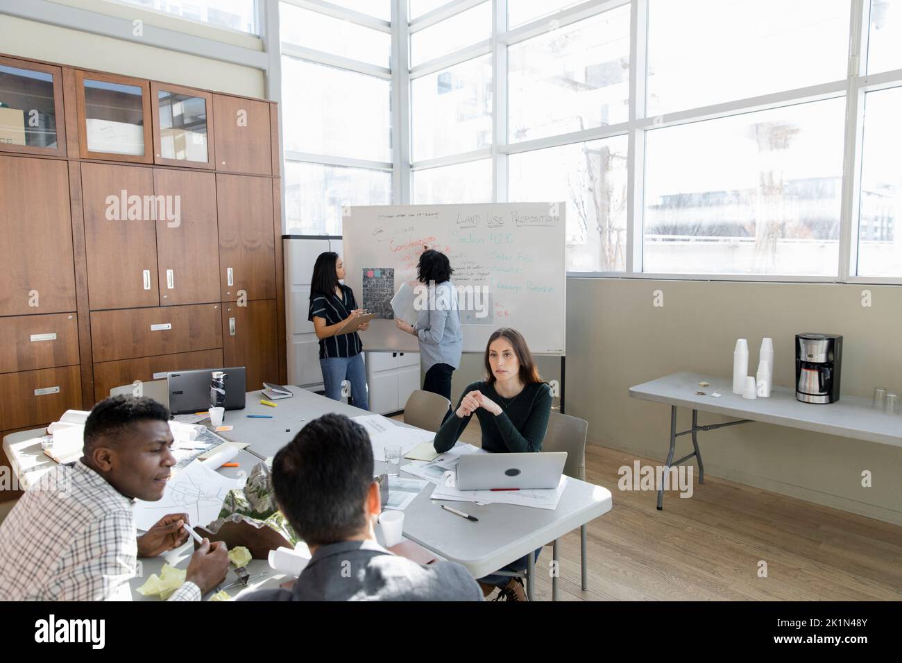 Land use planners talking in conference room meeting Stock Photo Alamy