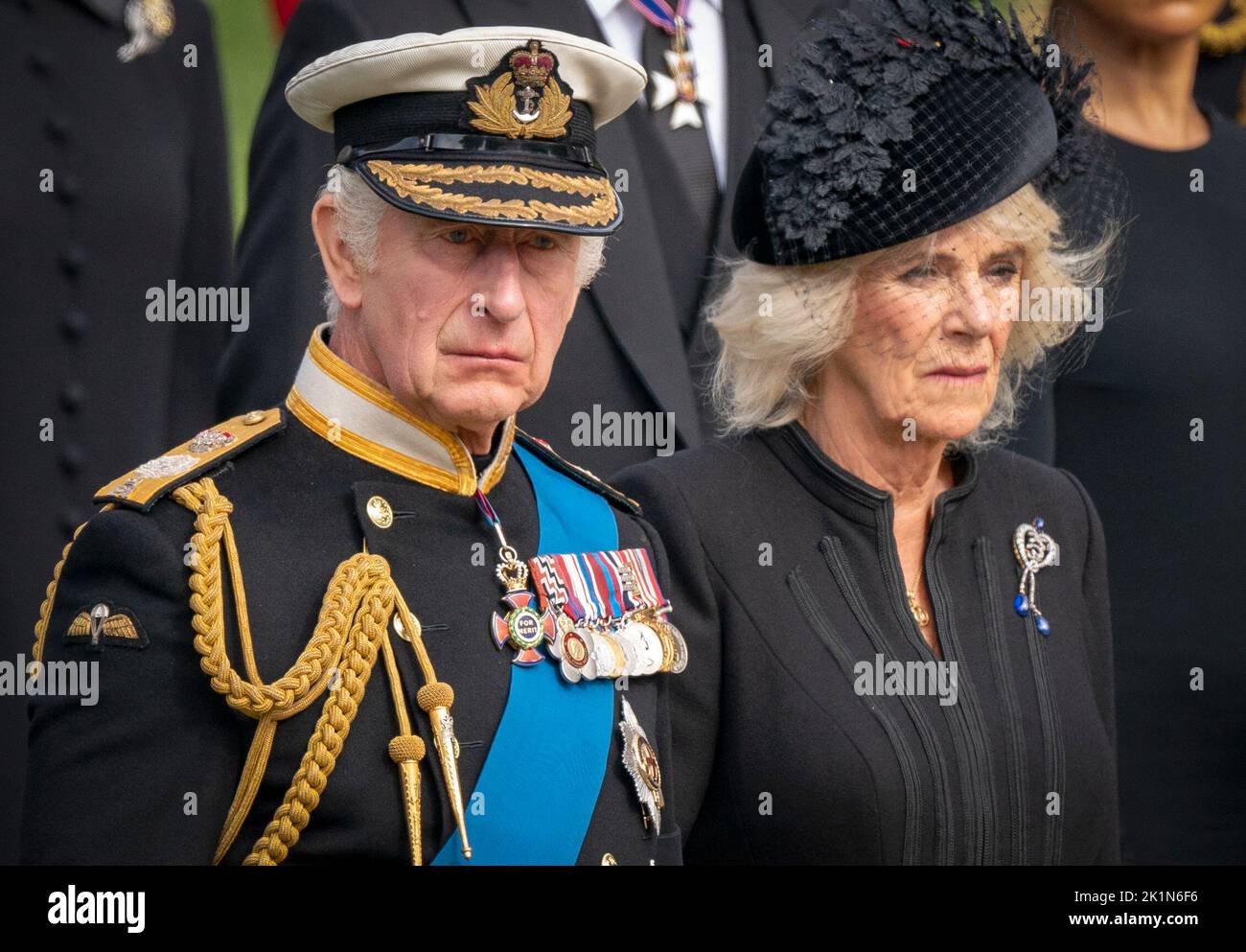 King Charles III and the Queen Consort look on as the State Gun Carriage carrying the coffin of Queen Elizabeth II arrives at Wellington Arch during the Ceremonial Procession following her State Funeral at Westminster Abbey, London. Stock Photo