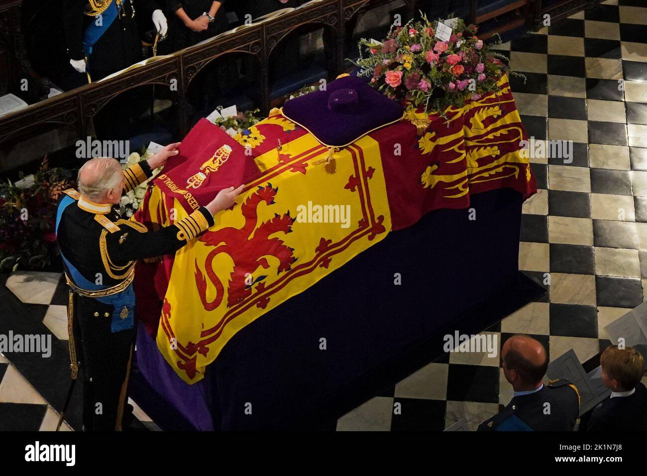King Charles III places the the Queen's Company Camp Colour of the Grenadier Guards on the coffin during the Committal Service for Queen Elizabeth II held at St George's Chapel in Windsor Castle, Berkshire. Picture date: Monday September 19, 2022. Stock Photo