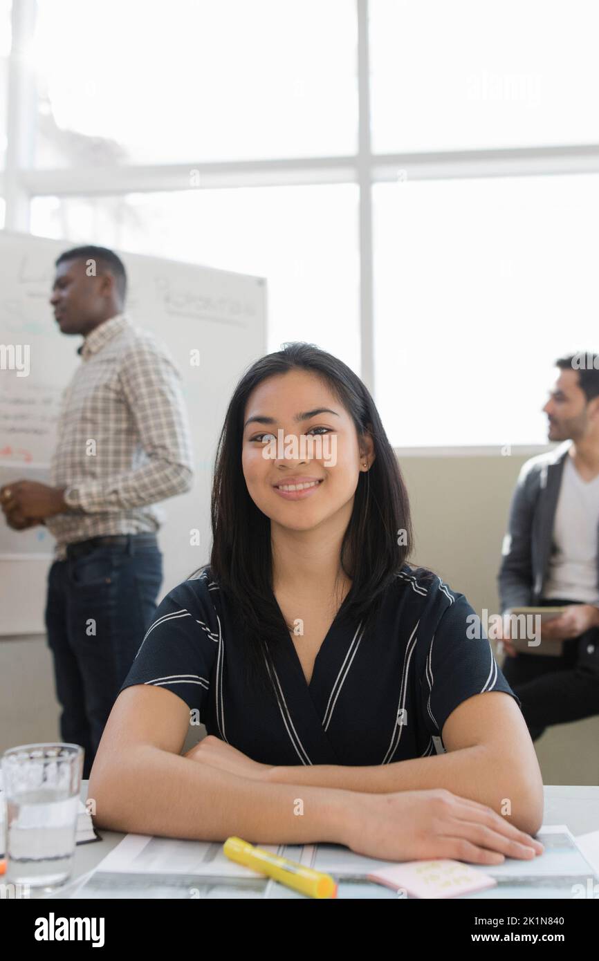 Portrait confident young female land use planner in meeting Stock Photo