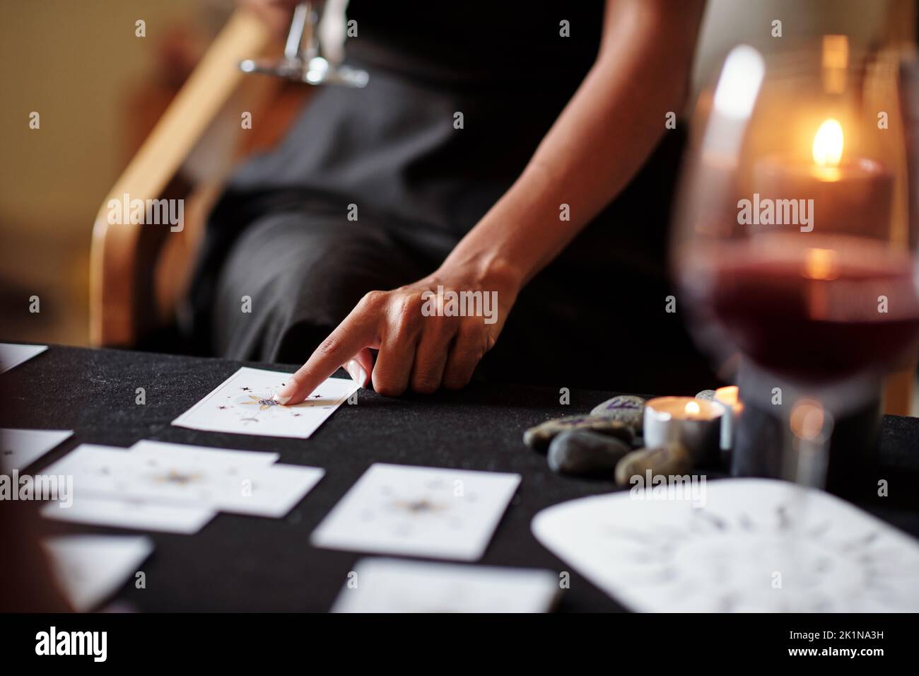 Closeup image of tarot cards reader explaining meaning or arcanes to ...