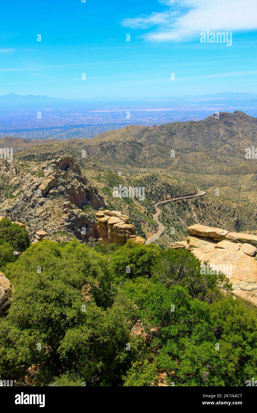 Distant highway throguh Catalina Mountains in AZ Stock Photo